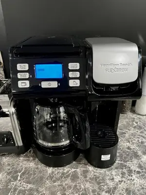 a coffee maker is sitting on top of a coffee machine at Edinburgh in Drummondville
