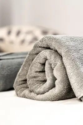 a close up of a blanket on a bed at Vivez la ville depuis le centre in Montréal