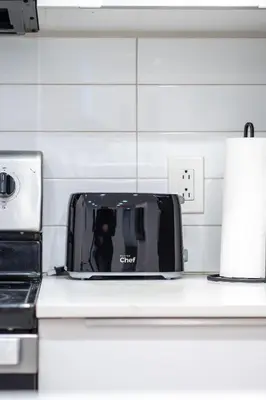 a toaster sitting on top of a kitchen counter at Confort moderne au cœur de Montréal in Montréal