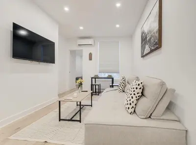 a living room with a couch and a table at Confort moderne au cœur de Montréal in Montréal