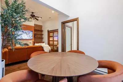 a dining room with a table and chairs at Bright Montreal Loft, Trendy Downtown Escape in Montréal