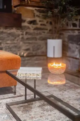 a living room with a table and a vase at Downtown Montreal Gem, Walk Everywhere Easily in Montréal