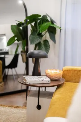 a coffee table with a plant in a living room at Stylish Retreat Near Crescent & Sainte-Catherine in Montréal