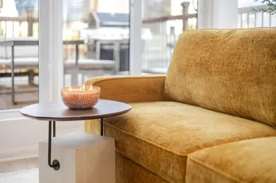 a living room with a couch and a table at Montreal Downtown Haven, Walk to All Attractions in Montréal