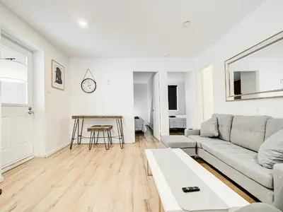 a living room with a couch and a table at Appartement central à Montréal - À deux pas de tout in Montréal