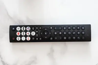a black remote control sitting on top of a counter at Appartement au centre-ville in Montréal