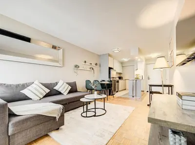 a living room with a couch and a table at Appartement au centre-ville in Montréal