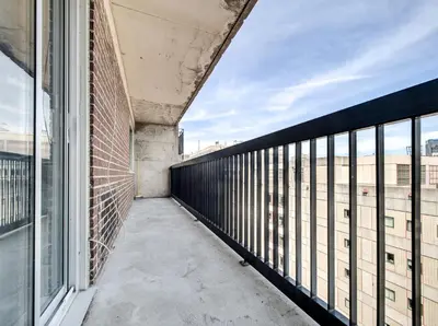a balcony with a view of a building at Appartement au centre-ville in Montréal