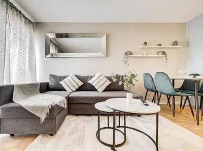 a living room with a couch and a table at Appartement au centre-ville in Montréal