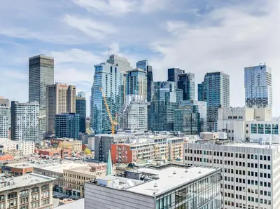 a view of a large city with tall buildings at Appartement au centre-ville in Montréal