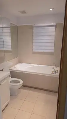 a bathroom with a tub and a toilet and a sink at Résidence J'aime in Laval