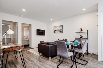 a living room with a couch and a table at Séjour pratique à Montréal, proche du vieux port in Montréal
