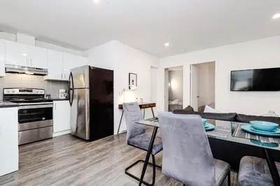 a kitchen and living room with a table and chairs at Séjour pratique à Montréal, proche du vieux port in Montréal