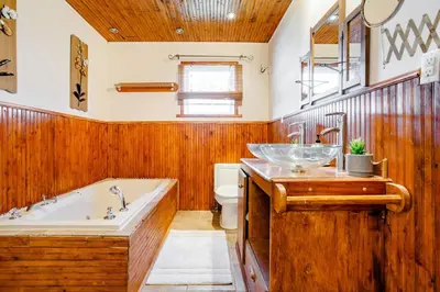 a bathroom with a tub and a sink at Luxury House Near Montreal Self Check-In in Longueuil