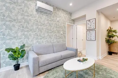 a living room with a couch and a table at Mont Royal Suites - M11 in Montréal