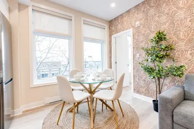 a dining room with a table and chairs at Mont Royal Suites - M11 in Montréal