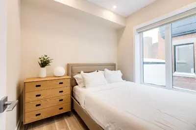 a bedroom with a bed and a window at Mont Royal Suites - M11 in Montréal