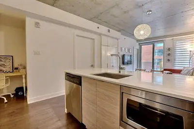 a kitchen with a sink and a counter top at Highrise 1BDR Condo in Downtown Montreal - Long Term Stay by M11 in Montréal