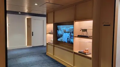 a room with a television in a display case at chambre au centre ville de Montréal in Montréal