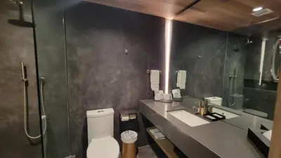 a bathroom with a toilet and a sink and a shower at chambre au centre ville de Montréal in Montréal