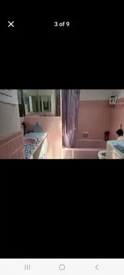 a picture of a kitchen with a bath tub at Very large room in Montréal
