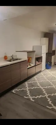 a kitchen with a sink and a counter top at small modern 2 bedrooms in Montréal