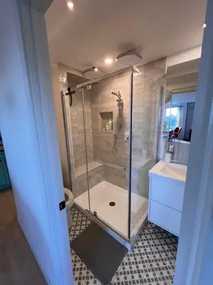 a bathroom with a shower and a toilet and a sink at Loft à la campagne in Waterville