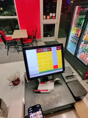 a computer monitor sitting on a table in a store at Appartment 1 bedroom in Longueuil