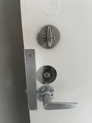 a clock on a wall with a metal object at Appartment 1 bedroom in Longueuil