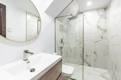 a bathroom with a sink and a mirror at Au coeur du plateau in Montréal