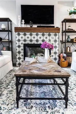 a living room with a coffee table and a fireplace at Historical Home - Near Montreal in Longueuil