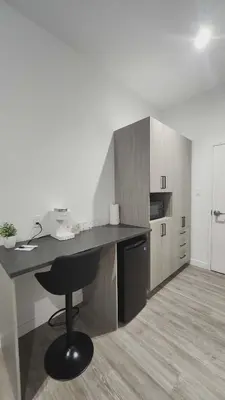 a kitchen with a desk and a counter top at La Baraque in Thetford Mines