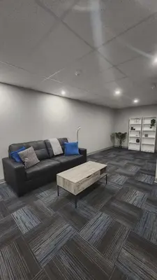 a living room with a couch and a coffee table at La Baraque in Thetford Mines