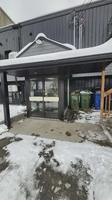 a screened in porch with snow on the ground at La Baraque in Thetford Mines