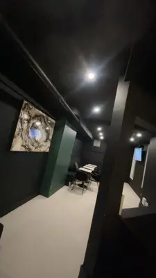 a dark room with a room with a table in it at Carbone in Montréal