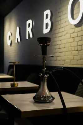a table with a coffee maker on top of it at Carbone in Montréal
