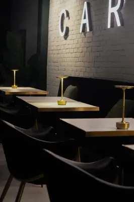a row of tables and chairs in a restaurant at Carbone in Montréal