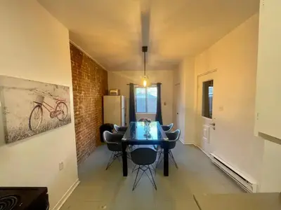 a dining room with a blue table and chairs at FULL KITCHEN 12min from DTOWN Room B in Montréal