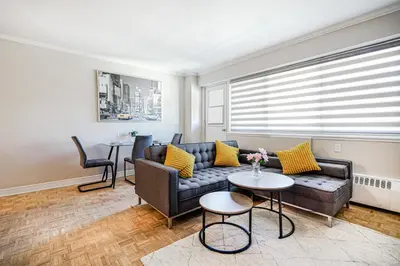a living room with a couch and a table at Appartement chaleureux pour un séjour parfait in Montréal
