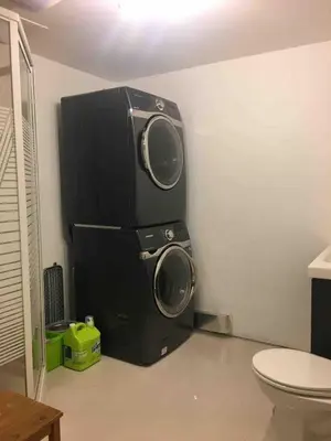 a speaker in a room with a toilet at Charming chalet for rent next to Owl Head SKI in Potton