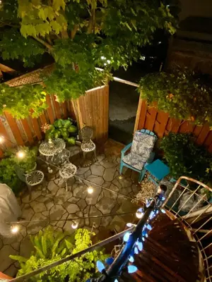 an overhead view of a garden with a bench and chairs at Montreal Hideaway in a Residential area in Montréal