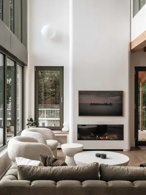 a living room with a couch and a fireplace at Wild Pond Villa in Mansonville