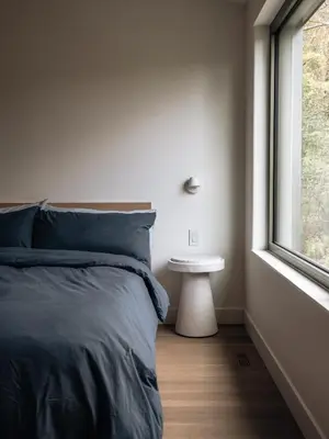 a bedroom with a bed and a window at Wild Pond Villa in Mansonville