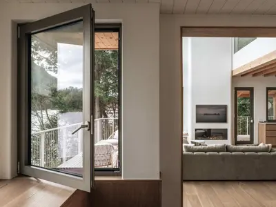 a living room with a sliding glass door at Wild Pond Villa in Mansonville