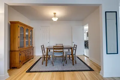 a dining room with a table and chairs at 2CAC rénover, tranquille, près du parc, commodités et activités in Montréal
