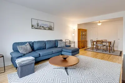 a living room with a blue couch and a table at 2CAC rénover, tranquille, près du parc, commodités et activités in Montréal