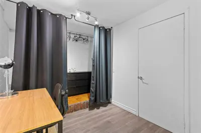 a room with a wooden table and a door at NEW LOFT -WIFI -Quiet -Tohu -Easy Transit -Park in Montréal