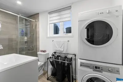 a bathroom with a washing machine and a sink at NEW LOFT -WIFI -Quiet -Tohu -Easy Transit -Park in Montréal