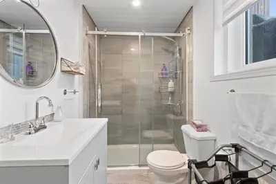 a bathroom with a shower and a toilet and a sink at NEW LOFT -WIFI -Quiet -Tohu -Easy Transit -Park in Montréal