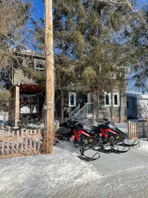 a group of motorcycles parked in front of a house at Beautiful cottage waterfront in Trois-Lacs